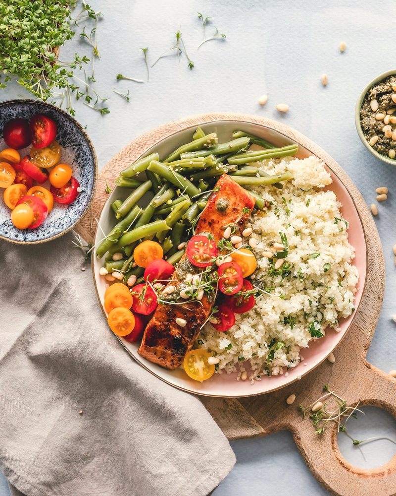 Baked salmon with rice and green beans, gently cooked