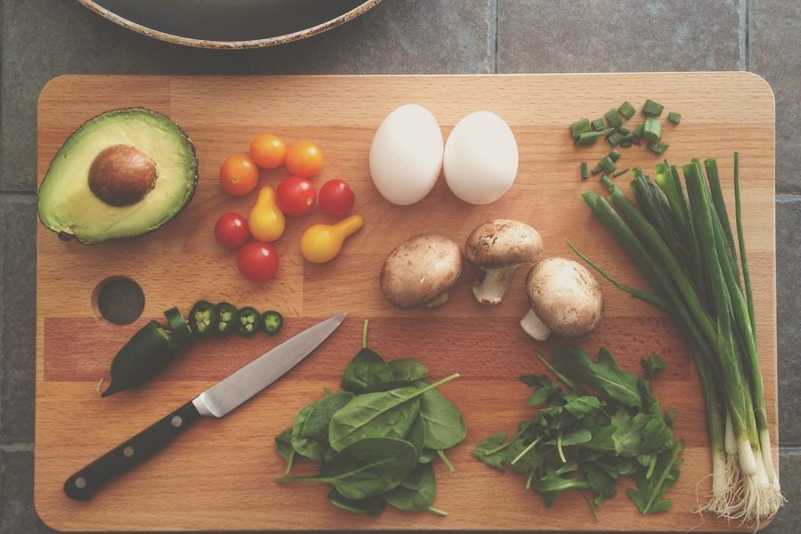 Fresh cooking ingredients prepared on a wooden board
